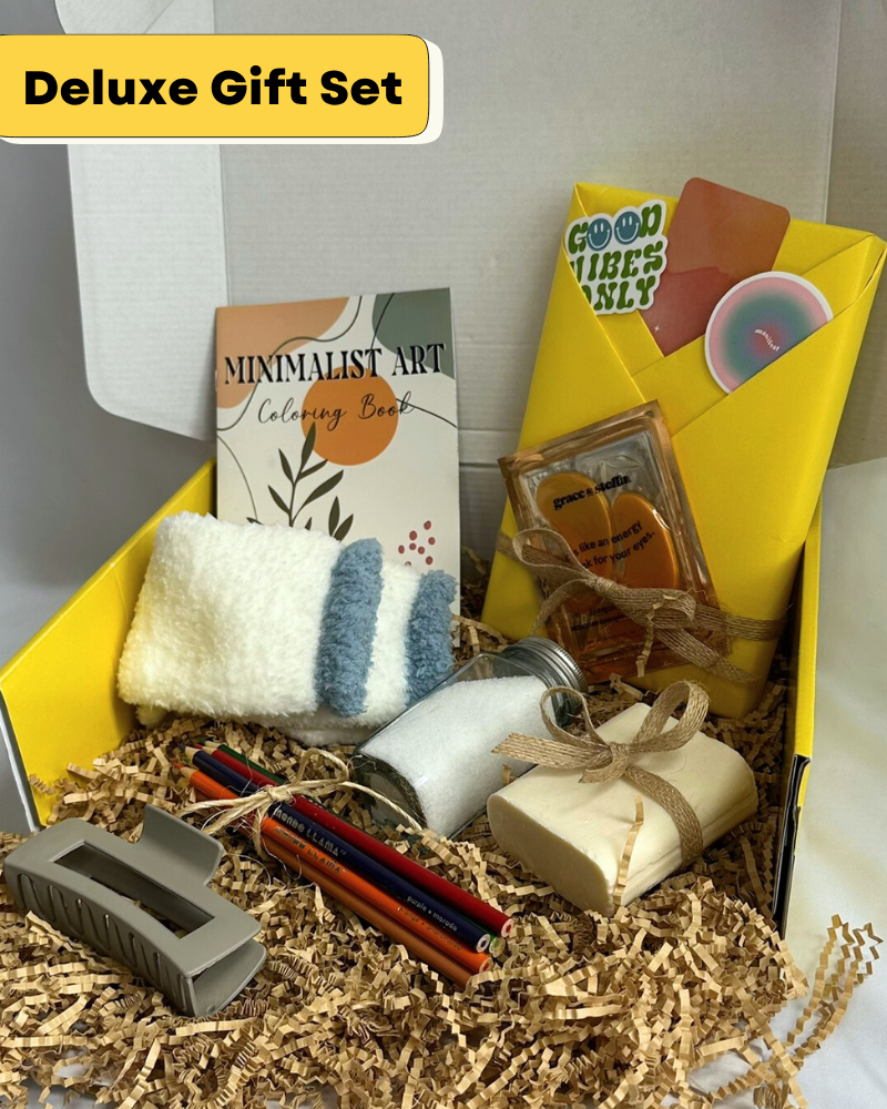 Gift Box with cozy socks, bar soap, bath salts, coloring book, colored pencils, hair clip, featuring a blind date with a book with bookish items. 