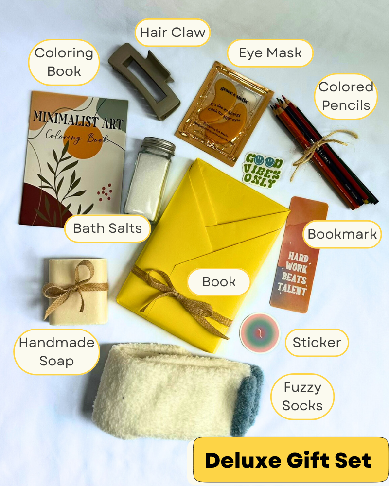 Gift Box with cozy socks, bar soap, bath salts, coloring book, colored pencils, hair clip, featuring a blind date with a book with bookish items. 